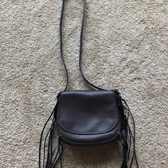 coach fringe saddle bag